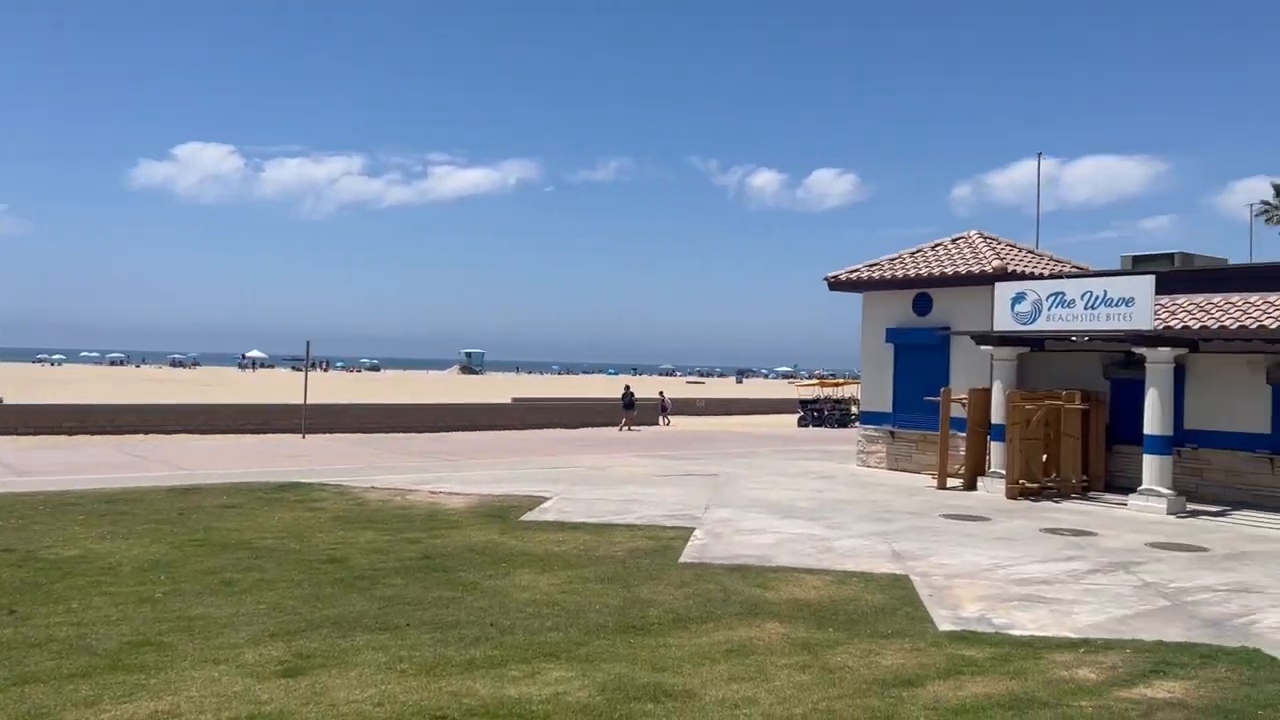Sandy beach and concession stand at Huntington Beach. 